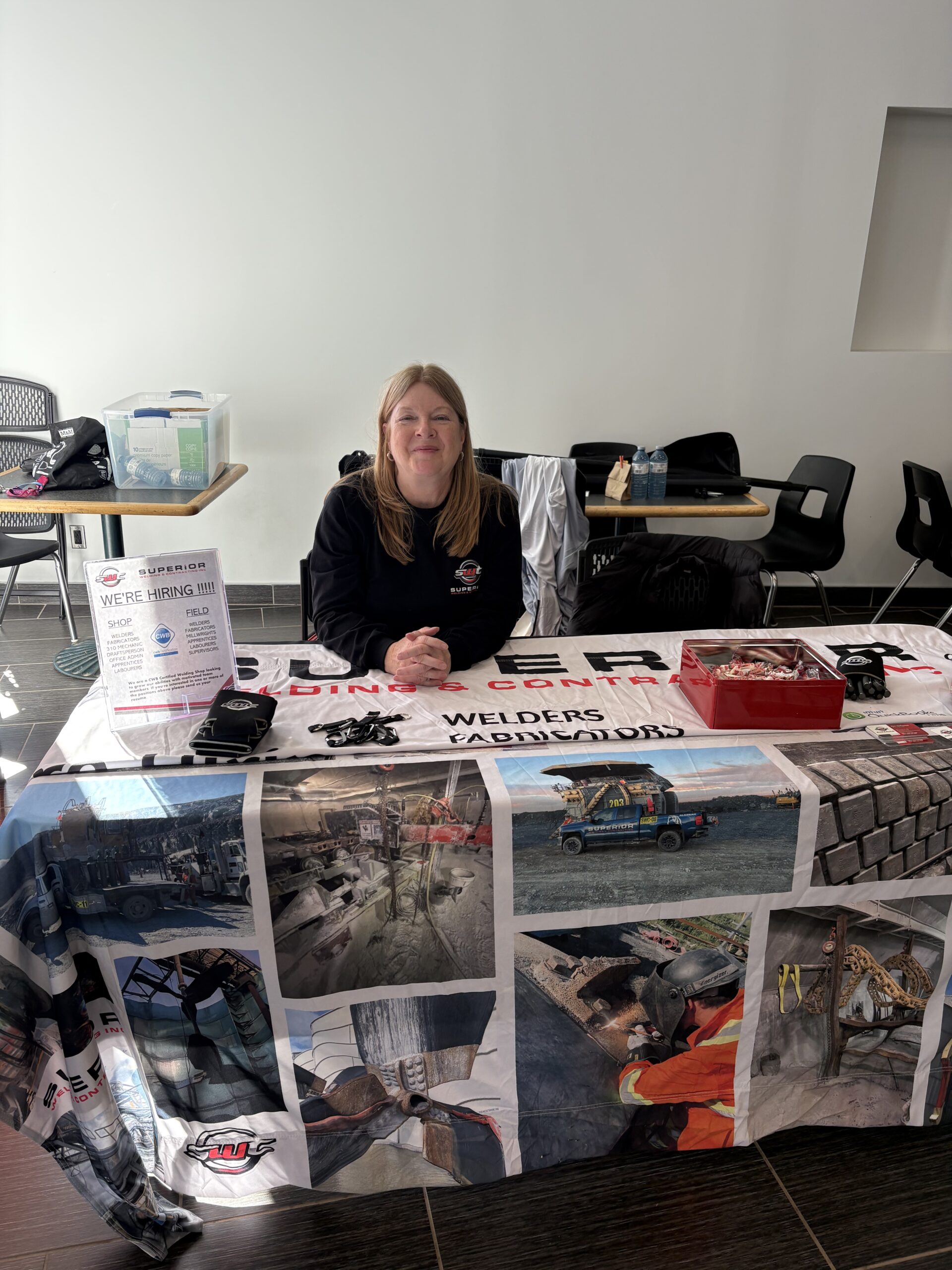 Employees at a booth at the local job fair.