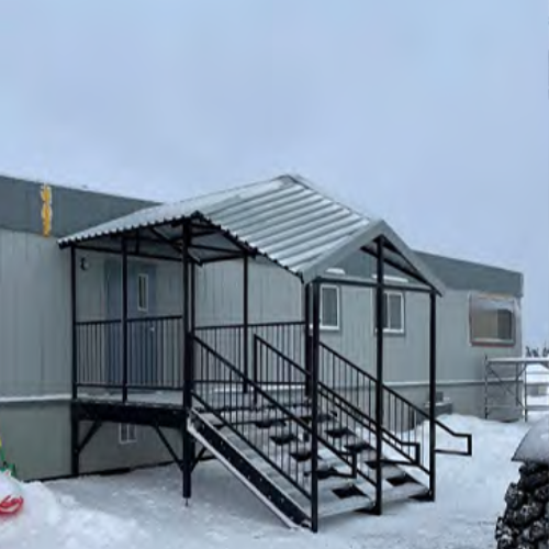 A custom built stairway with rooftop cover.