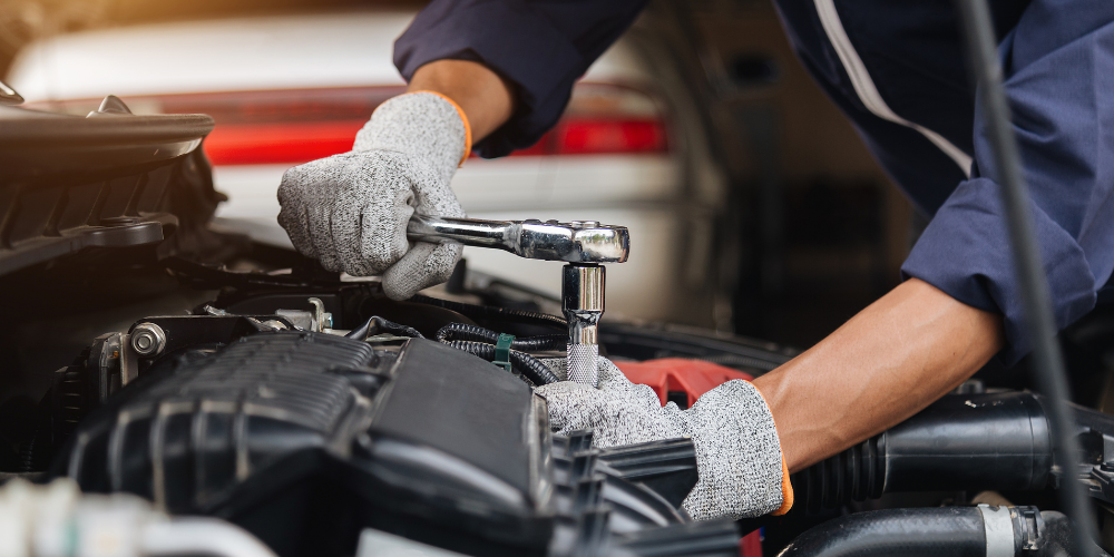A mechanic working on a fleet vehicle.